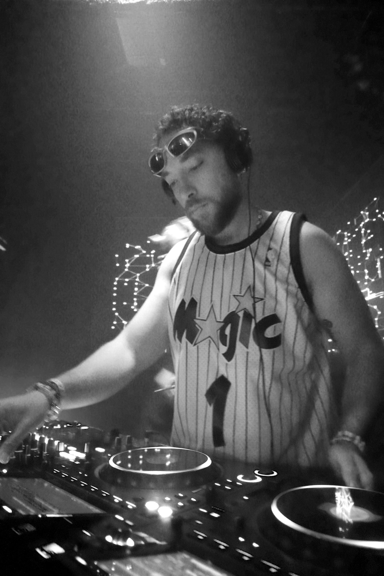 Conobi in an Orlando Magic jersey, mixing under red light
